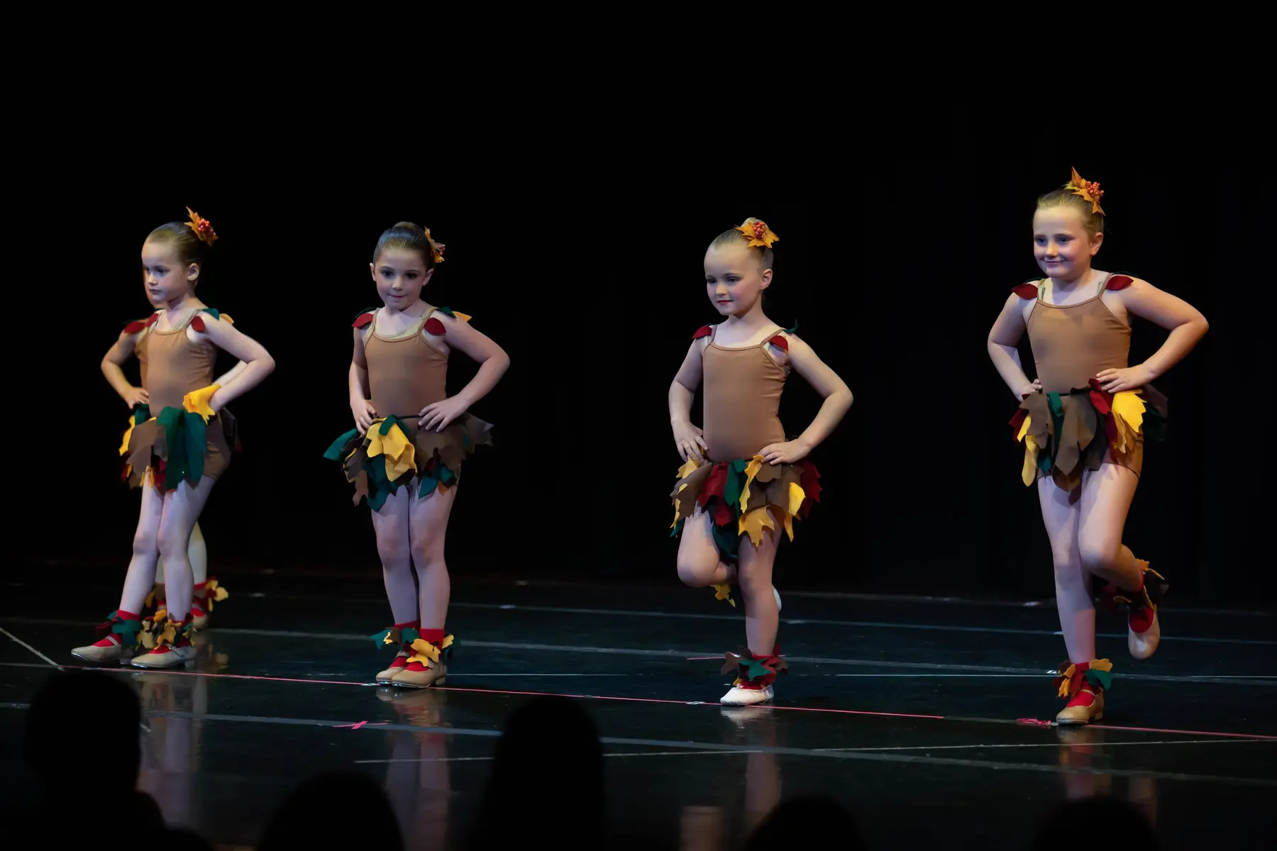 FLBA combo class students dressed as autumn leaves in performance